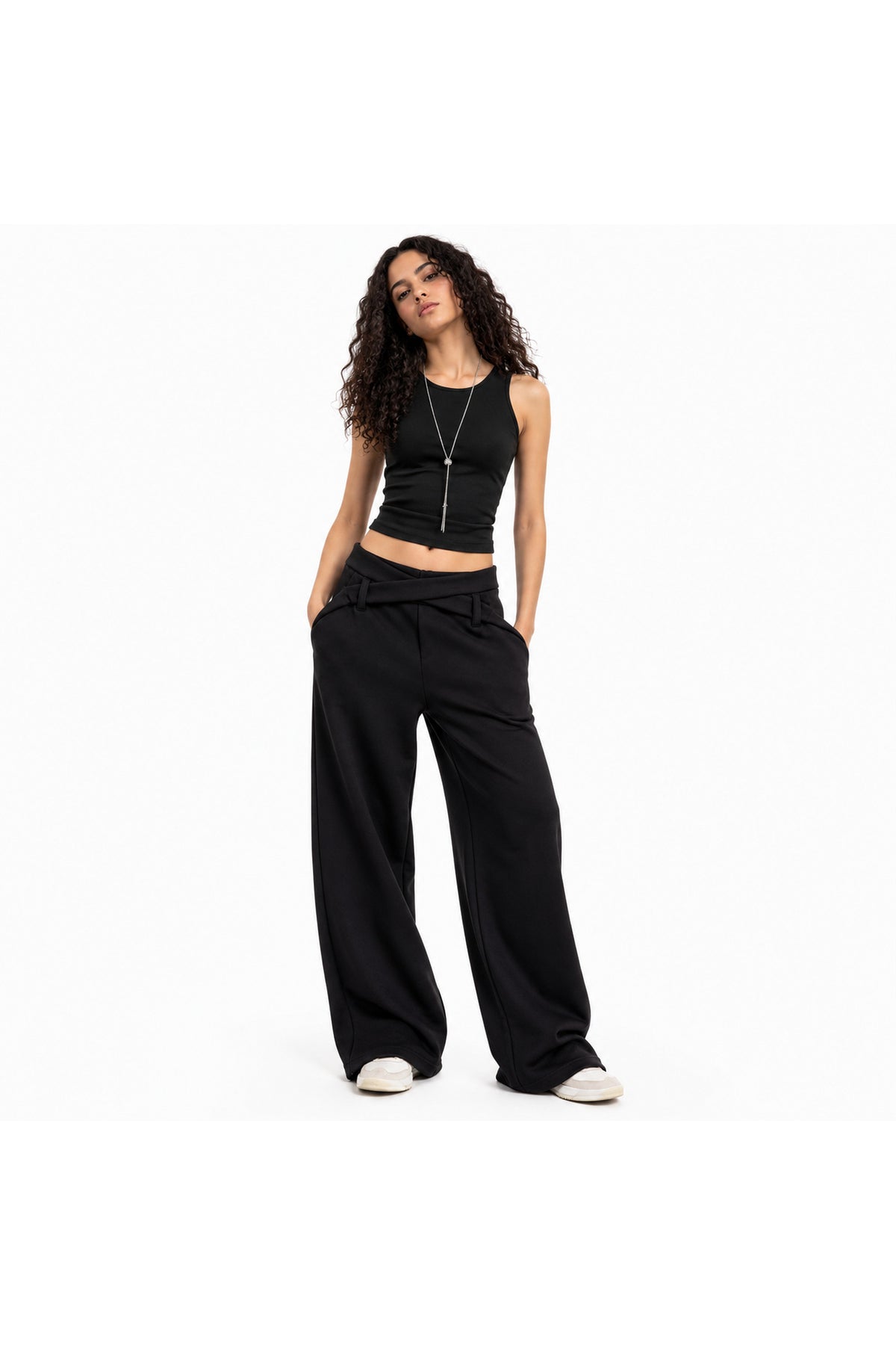 Wrap waist wide leg pants in black worn on model — wujud